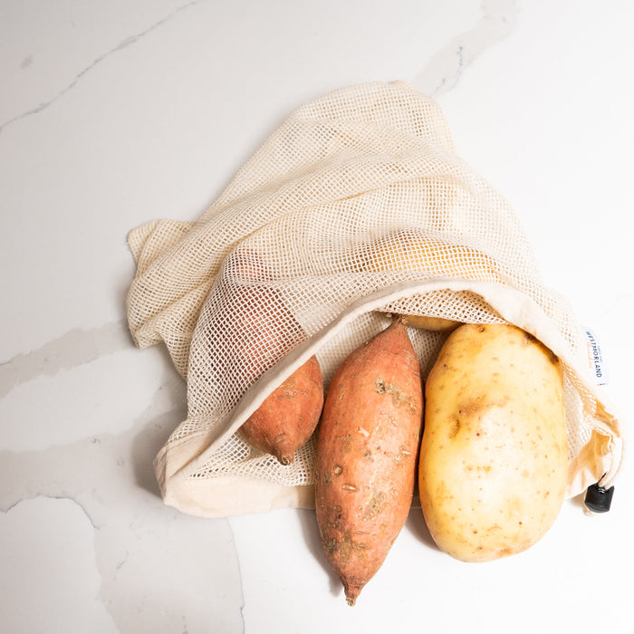 Cotton Mesh Reusable Bag with potatoes inside.