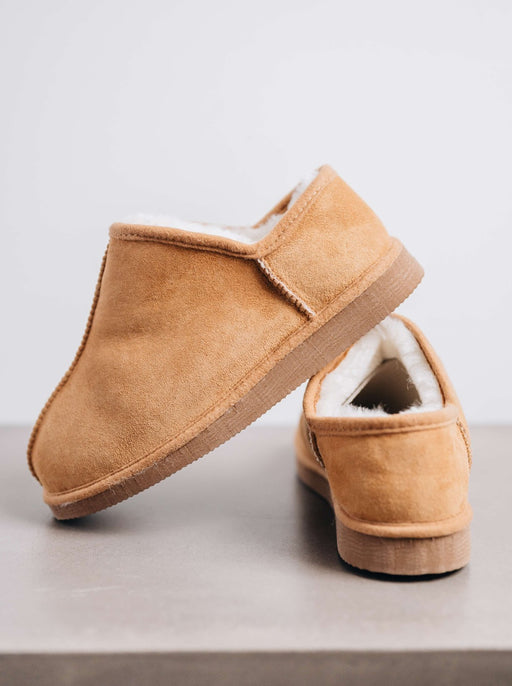 Side view of CADI in Mel Sheepskin Unisex Slipper, designed by Westmorland Sheepskins. Features a small branded cork tag sewn into outer trim.