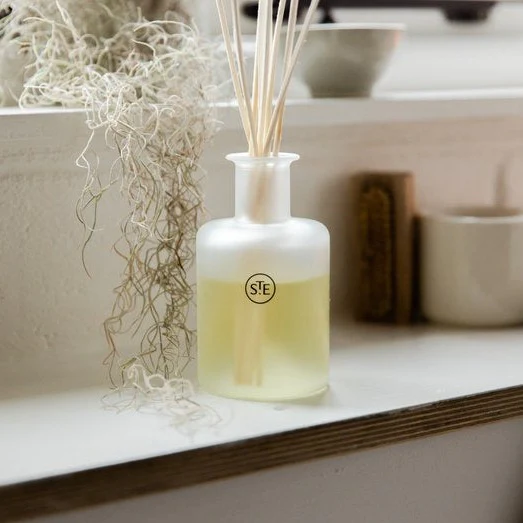 St. Eval Reed Replacement Bundle. Features a a reed diffuser. Displayed on a wooden shelf