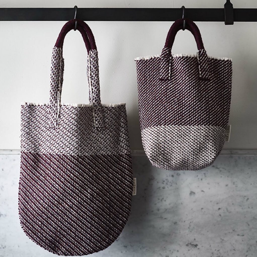Rag Makers patterned puple and white oval bottomed bags with a long handle.
