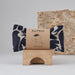 Navy Blue Abstract pattern Small Creatures Eye Pillow. Made by Blästa Henriët. Packaged in brown cardboard informational sleeve with illustration of its use.