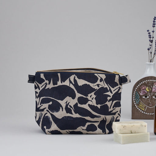 Large Navy Blue Abstract Small Creatures Patterned Blästa Henriët Linen Wash Bag. Includes gold zipper for easy opening.