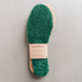 Green AW22 colour Sheepskin Children's Cuttable Insoles. Cut to size. Wrapped in a cardboard informational sleave.