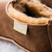 Close up of Westmorland Sheepskins Branded Sewn in tag on upper seam of Gryff Sheepskin brown Slippers.