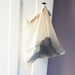 A mesh cotton reusable bag for produce.