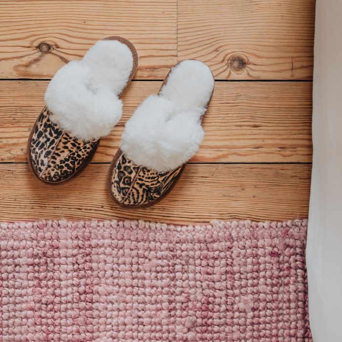 womens hard sole slip on sheepskin slippers in roarsome animal print
