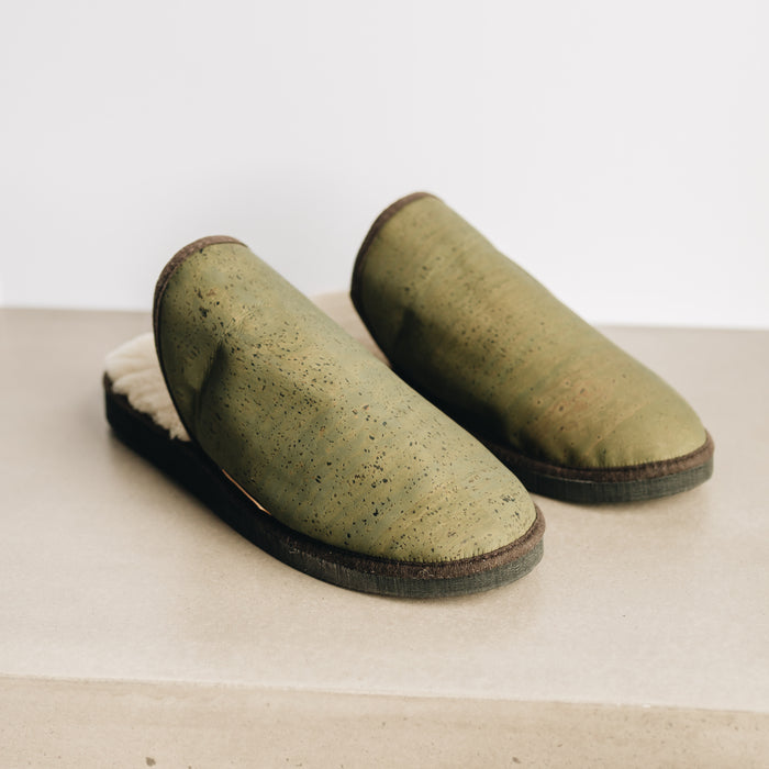 AW22 Forest Green Cork and Sheepskin Slider Slipper. Men's Sheepskin Slippers, with Forest Green Cork Outer Material, fold over Sheepskin Cuff and dark outer sole. With small branded Westmorland Sheepskin Cork tag.