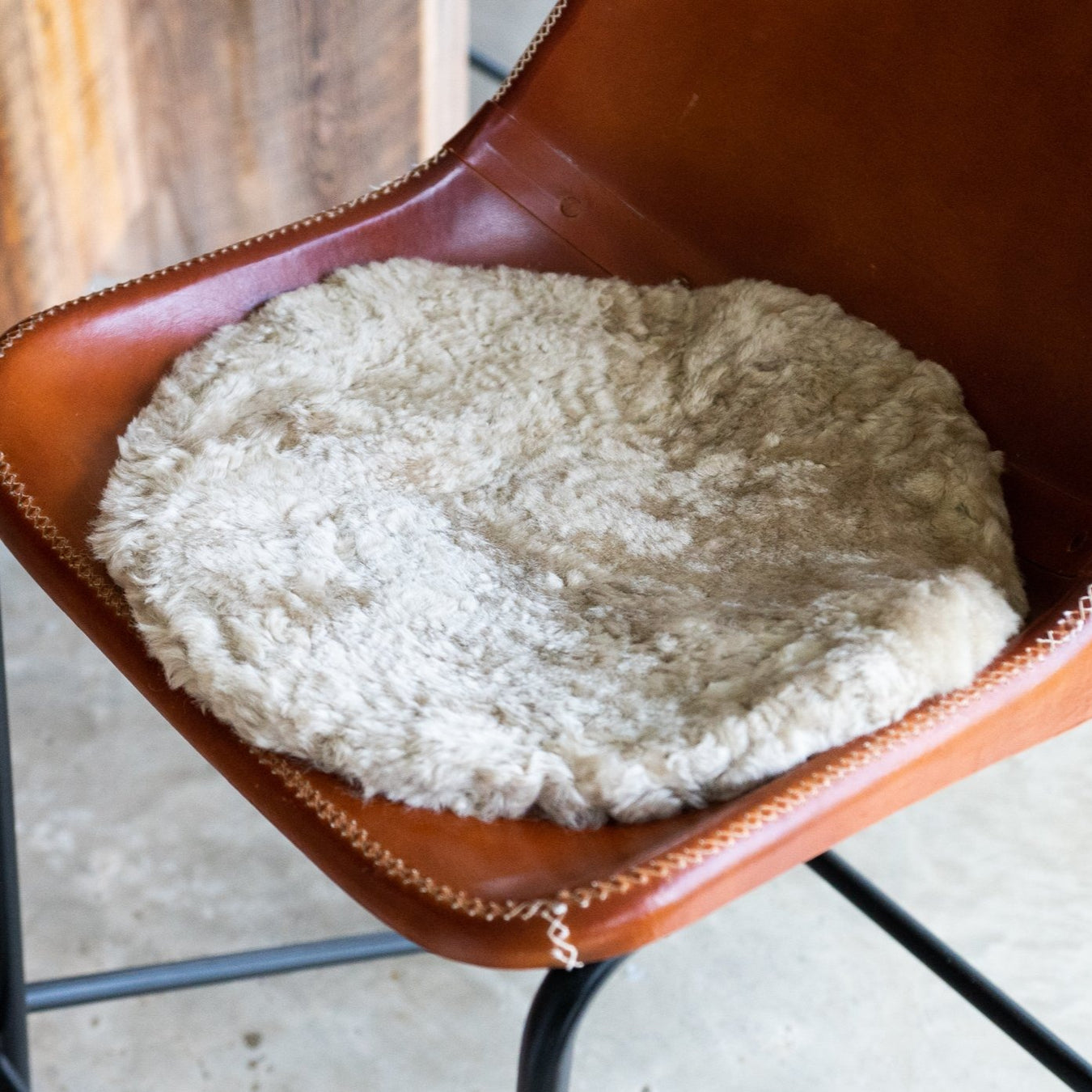 Oatmeal Round Waste Less Sheepskin Padded Seat Pad.