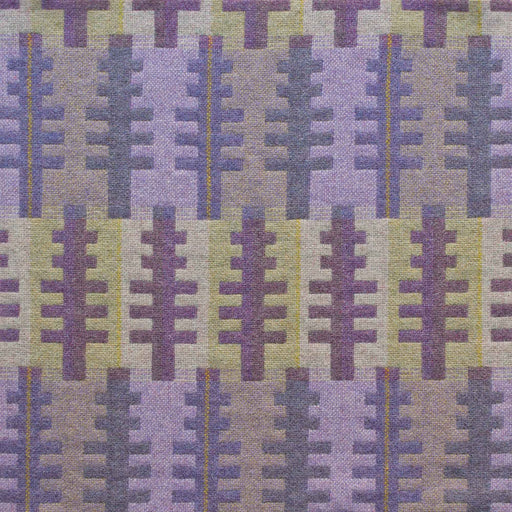 Close up of reverse of Forest woven wool textiles by Melin Tregwynt. Features tree like shapes in purples set against a green and purple striped background.