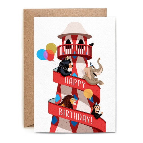 Happy Birthday Card. A white verticle card, features a red Helter Skelter with wild animals holding balloons sliding down. On the side of the Helter Skelter reads 'Happy Birthday!'. Comes with an envelope.