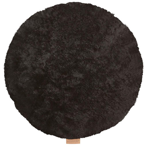 Jill, a black round Sheepskin seat pad, made by Shepherd of Sweden. Small Shepherd branded tag sewn in.