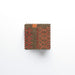 Melin Tregwynt Knot Garden Copper Woven Wool Coasters with a crimped edge.