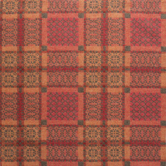 Copper reverse fabric for Orange Melin Tregwynt Knot Garden Woven Wool Throw. A rusty copper colour, with detail pattern in rust red, pale orange and grey.