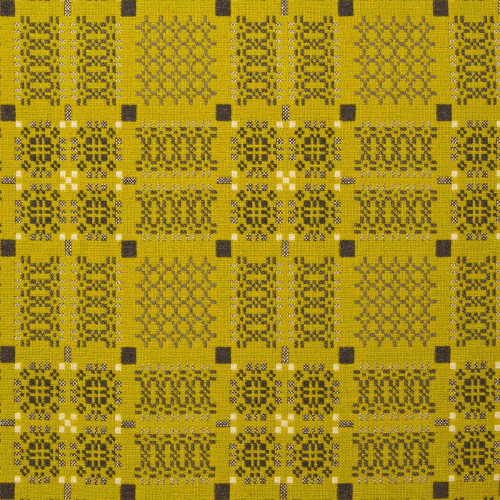 Gorse fabric for Yellow Melin Tregwynt Knot Garden Woven Wool Throw. A bright daffodil yellow colour, with detail pattern in charcoal grey, white and light grey.