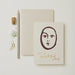 Portrait To A Beautiful Soul Greetings Card. A verticle card, features a brown simplistic line drawing of a face. At the bottom of the card in gold foil writing reads 'to a beautiful soul'. Comes with an envelope.