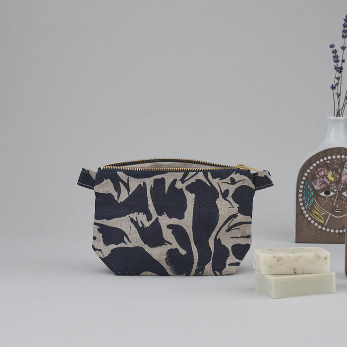 Small Linen Wash Bag with Navy Blue Small Creatures pattern. Abstract patterned Wash bag from Blästa Henriët.
